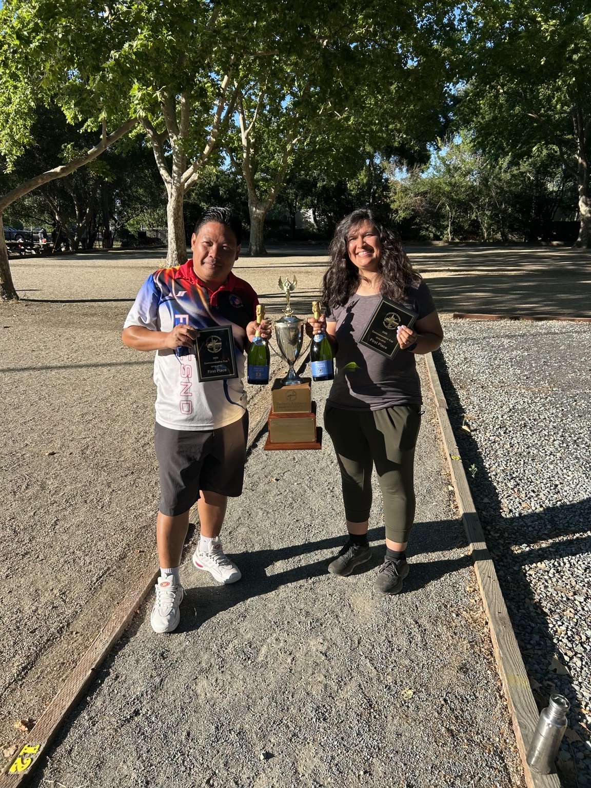 Fresno mixed doubles champions with trophy
