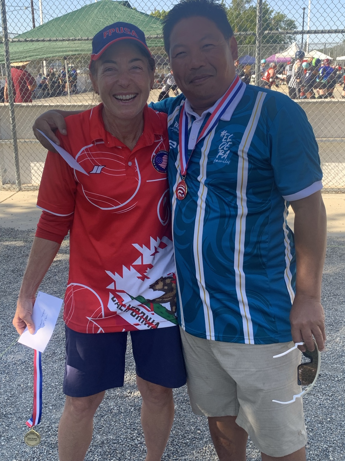 Janice and Kham celebrating with medals at the Fresno Regional Singles